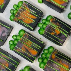 green and orange candies are arranged on top of each other in the shape of squares