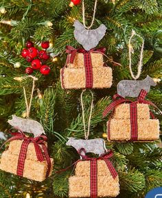 christmas ornaments made out of rice krispy kreme treats hanging from a tree