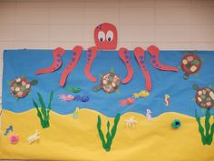 a bulletin board with an octopus and sea animals on it