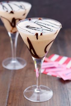 two glasses filled with ice cream and chocolate