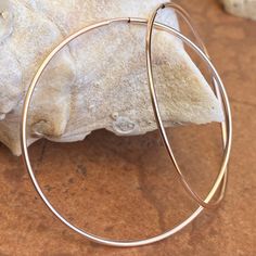 Rose gold-filled thin endless tube hoop earrings. Great, lightweight pink gold, large hoop earrings! Also available in a larger hoop size. Measures: 50.8mm Thickness: 1.3mm Weight: 1.2g 14/20 rose gold filled Tube Hoop Earrings, Saint Jewelry, Large Hoop Earrings, Fabric Ribbon, Gold Polish, Paper Decorations, Pink Gold, Medium Size, Pink And Gold