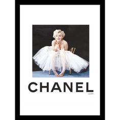 a framed photograph of a baby in a tutu with the words chanel on it