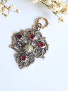 Beautiful antique  pendant with natural stones.  Austro-Hungarian  Metall -  silver  Stones - Natural  stons garnet and perls Marked - UNMARKED  Size -    Long      -   3.3  cm                               -   1.29 inches  Please note- quite possibly it was originally a pendant from a necklace.  look for the photo.  Good   vintage condition. PLEASE VIEW ALL PHOTOS AS THEY ARE A PART OF THE DESCRIPTION If you have any further questions or you need some help with something, please get in touch with us. We will be happy to help you. The other jewels on the last page you can find in my other auction. please visit Instagram my name is - MyOldVintage - Please feel free to browse my other items and be sure to follow me on Instagram myoldvintage , to see videos of my collection. If you have any q Austro Hungarian, Antique Pendant, Star Ring, Silver Pendant, Garnet, Natural Stones, Jewelry Necklace Pendant, Take That, Jewelry Necklaces