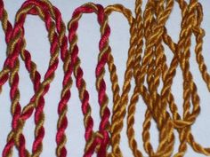 three different types of braiding on a white surface with one red and one gold