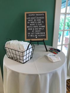 a table with a basket and sign on it