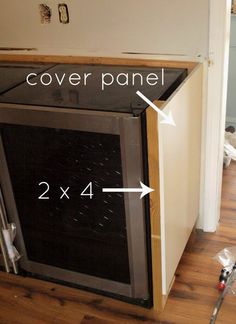 an oven is shown with the cover panel down and 2x4 inches above it