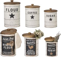 four canisters with labels and flowers on them