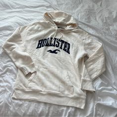 Hollister Hoodie Size Large Condition: Nwt Color: White Details : - Comfy - Logo Across Front - I Ship Between 1-2 Days Casual Cream Hoodie Sweatshirt, Sporty Cream Hoodie Top, Hollister Hoodie, Hollister Sweater, White Details, Colorful Hoodies, Hollister, Men Sweater, Color White