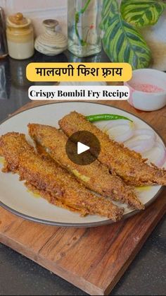 an image of crispy fish fry on a plate with the caption'crispy bonbi fry recipe '