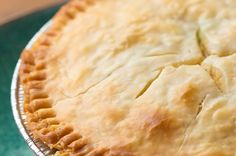 a pie sitting on top of a green table