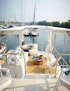 a woman sitting on the back of a boat