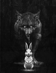 a black and white photo of a wolf with a rabbit in front of it's face