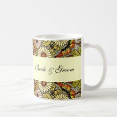 a coffee mug with the words bride and groom on it, surrounded by daisies