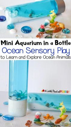 a bottle filled with water and sea animals next to an ocean scene play set for kids