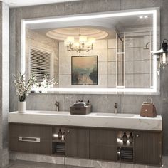 a bathroom with two sinks and a large mirror