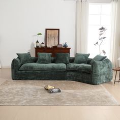 a living room filled with furniture and a rug