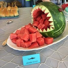 a watermelon shark with its mouth open on a plate