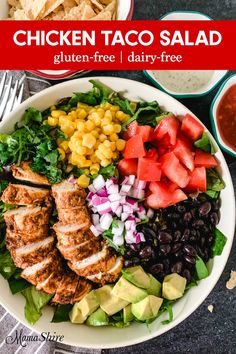 chicken taco salad with avocado, tomatoes, corn, black beans and cilantro