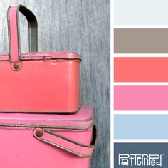 a pink suitcase sitting on top of a wooden floor next to a gray and white wall