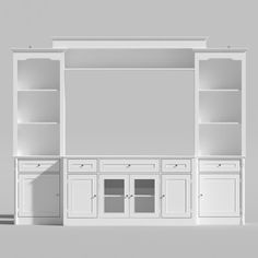 an empty white bookcase with doors and drawers in front of a gray wall background