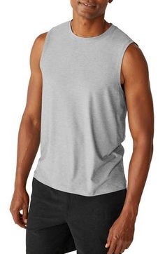 Radiate zen from the inside out with this supersoft tank featuring a stretchy knit and athletic fit. 28" length (size Medium) Crewneck Moisture-wicking fabric engineered for dryness and comfort 94% polyester, 6% elastane Machine wash, tumble dry Made in the USA of imported materials Men Yoga Outfit, Casual Racerback Activewear With 4-way Stretch, Stretch Athleisure Sleeveless Muscle Tee, Stretch Sleeveless Muscle Tee For Athleisure, Athleisure Sleeveless Muscle Tee Relaxed Fit, Athleisure Muscle Tee Sleeveless Relaxed Fit, Sports Muscle Tee Tank With Relaxed Fit, Athleisure Relaxed Fit Sleeveless Muscle Tee, Sports Muscle Tee With Relaxed Fit Tank Shape