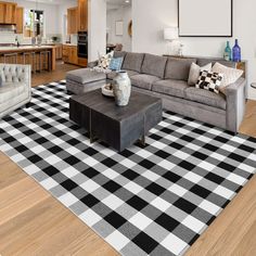 a living room filled with furniture and a checkered rug