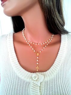 This is a stunning rosary necklace made of 3-4mm Freshwater Pearls on 24kt gold vermeil. This necklace measures 36 in length and may be worn doubled for a layering look of 18 length. The gold clasp closure connects to center medallion which makes this necklace so unique. A White Crucifix Necklace For Jewelry Making, White Crucifix Jewelry For Wedding, Elegant White Cross Rosary, White Crucifix Jewelry With 8mm Beads, Bride Wedding Jewelry, Silver Rosary, Cross Necklaces, Wedding Bride Jewelry, Crystal Cross