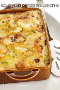 a casserole dish with potatoes and parsley