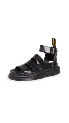 PRICES MAY VARY. Gladiator style sandal Adjustable ankle strap Made with classic Docs DNA, including grooved edges, a heel-loop and visible stitching Constructed on the iconic and comfortable Dr. Martens air-cushioned sole 1. 5" platform Dr Martens Clarissa Ii, Clarissa Sandals, Dr Martens Clarissa, Sandal Outfits, Leather Strap Sandals, Trending Sandals, Chunky Sandals, Denim Shoes, Stuart Weitzman Shoes