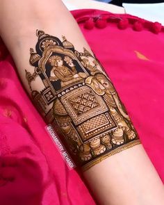 a woman's arm with henna on it