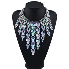 Rhinestone Multicolored Bohemian Chunky Necklace. Women Choker Maxi Statement Necklace. This high-quality piece features a bold design with dazzling rhinestones in a playful array of colors, adding a touch of bohemian flair to any outfit. Elevate your style effortlessly with this chic and comfortable accessory, perfect for making a statement at any occasion. Style: TRENDY Shape\pattern: Geometric Necklace Type: Chains Necklaces Metals Type: Zinc alloy Material: Rhinestone Chain Type: Water-wave Multicolor Jeweled Beaded Necklace For Party, Silver Rhinestone Crystal Necklace For Festival, Bohemian Crystal Jewelry With Colorful Beads, Party Beaded Alloy Necklace, Bohemian Crystal Choker Necklace For Party, Multicolor Rhinestone Necklace With Sparkling Stones For Party, Party Multicolor Bling Jewelry, Multicolor Metal Rhinestone Necklace For Party, Bohemian Party Jewelry With Jewels