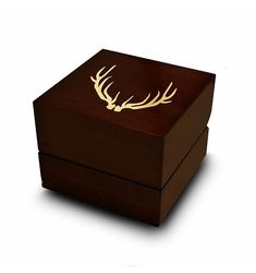 a wooden box with some deer antlers on it