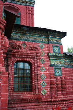 an old red brick building with a clock tower