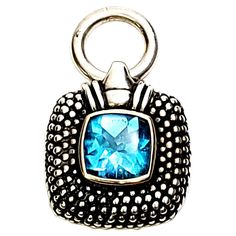 Sterling silver and 14K blue topaz pendant. This beautiful square sterling silver caviar style pendant features a square blue topaz bezel set in a 14K yellow gold bezel. Measures approx 1 3/4" long, 7/8" wide, 9mm thick, 8mm bale opening. Stone measures approx 10mm x 10mm. Weighs 10.7g, 6.8dwt. Marked 925 14K C in a circle and what appears to be S in a circle. Very nice condition with some slight surface scratching and light tarnish. Will come packaged in a gift box or pouch (when possible). Blue Topaz Pendant, Topaz Pendant, Vintage Sterling Silver, Blue Topaz, Sterling Silver Jewelry, Topaz, Jewelry Necklace Pendant, Silver Jewelry, Jewelry Necklaces