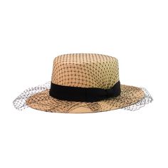 "Glamour" Cordovan Hat 100% Toquilla straw. This natural fiber is known for its quality and beauty. The perfect beach-to-city accessory. Each hat takes approximately two to three days to weave by hand by our Ecuadorian artisans, and after pressed for shape. Indulge in pure luxury with our "Glamour" Cordovan Hat. Handmade with toquilla straw and adorned with delicate tulle, this hat will elevate any outfit. Embody sophistication and exclusivity with every wear. -We ship with DHL Express. Shipping takes approximately 3 to 5 days to arrive depending on the destination.-Need Help? Please contact: customercare@sensistudio.com-All Sales Are Final. Elegant Natural Boater Hat For Garden Party, Chic Beige Straw Hat For Garden Party, Elegant Natural Straw Sun Hat, Gatsby Style Wide Brim Adjustable Hats, Elegant Woven Brimmed Straw Hat, Chic Beige Toquilla Straw Hat, Brimmed Straw Hats For Parties, Brimmed Straw Hats For Party, Elegant Woven Boater Hat For Kentucky Derby