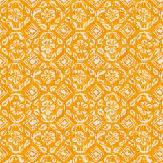 an orange and white pattern on fabric