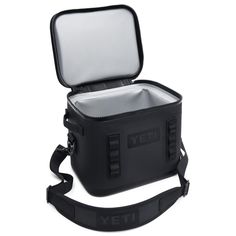 an open yeti cooler bag on a white background