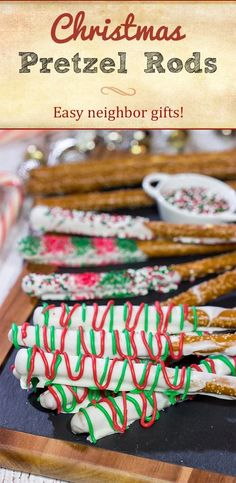 christmas pretzel rods on a cutting board with candy canes