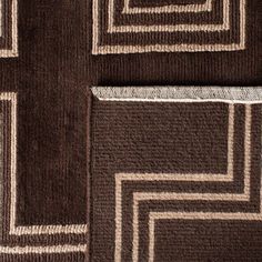 brown and white rugs with squares on them