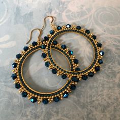 Extra Large Crystal Seed Bead Hoop Earrings Hoop earrings made with beautiful royal blue crystals, gold metallic and blue 11/0 seed beads. The color and sparkle of these gorgeous earrings is stunning. The french hook earwires and findings are 14kt gold plated. These very large very lightweight earrings measure approximately 3inches (7.62cm) total. The beaded hoops are slightly over 2.5 inches (6.35cm). Great for anytime. You will absolutely love this color and sparkle. Thanks for looking and ple Blue Wire Wrapped Hoop Beaded Earrings, Gold Round Beaded Earrings With Faceted Beads, Gold Round Faceted Beads Earrings, Beaded Jewelry Earrings, Beaded Jewelry Bracelets, Beaded Earrings Diy, Beaded Jewelry Designs, Beaded Earrings Patterns, Beaded Bracelet Patterns