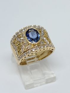 LeVian 18K Yellow Gold, Natural Diamond & Sapphire Ring Size 6.25 Beautiful 18K Yellow Gold LeVian ring with a 1.40 carat oval Sapphire in the center and 48 round diamonds on the side for a total diamond weight of 0.50 carats, H/I color and VS/SI clarity Pre-owned and polished for a showroom finish, total ring weight is 9.12 Grams Includes GAL Appraisal MSRP $6,850 Free ring sizing included, must include ring size with purchase order Shipped Free with USPS Priority Mail Luxury Oval Sapphire Ring With Pave Setting, Dazzling Oval Yellow Gold Sapphire Ring, Oval Sapphire Ring With Pave Setting, Classic Oval Sapphire Ring With Pave Setting, Exquisite Oval Ring With Pavé Setting, Exquisite Oval Rings With Pave Setting, Oval Sapphire Ring With Pave Setting For Anniversary, Oval Yellow Gold Topaz Ring With Vvs Clarity, Oval Pave Setting Fine Jewelry Ring