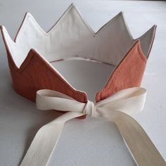 a paper crown with a ribbon tied around it