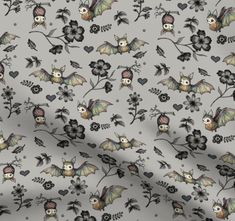 a bat and flowers pattern is shown on a gray background with black leaves, hearts, and skulls