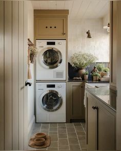 a washer and dryer in a small room