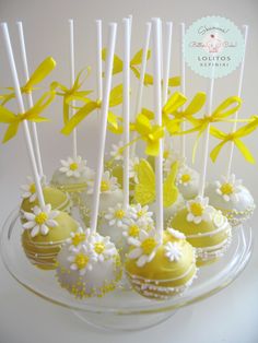 cake pops decorated with yellow and white flowers