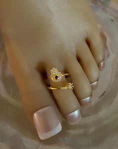 This gold toe ring features an evil eye with a crystal inlaid hand and a blue crystal accent in the middle of the hand.  A single crystal accent is at the tip of the toe ring that wraps around the toe. This toe ring is size adjustable and one size fits most. Comfortable and versatile, it will lend itself to casual or formal events. All items are made in a smoke free environment. *If there is any issue with your toe ring, please let me know so I can correct it.  Thanks for visiting my shop!👣 Gold Toe Rings, Columbia Tn, Ring Crystal, Toe Ring, Toe Rings, Blue Crystals, Evil Eye, Formal Event, Body Jewelry