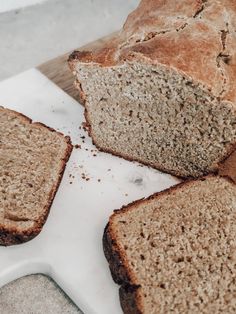 sliced bread sitting on top of a cutting board