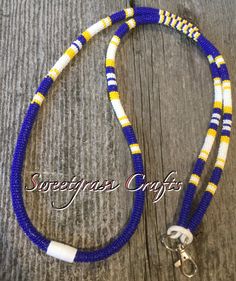 "This is a unisex beautifully wrapped safety/ breakaway seed bead lanyard that is 21\" inches long. This royal blue, yellow and white seed bead lanyard comes with a D ring making it very useful, it can hold keys, ID badges.  I am First Nation, Plains Cree so you are buying authentic items made by myself in a smoke & pet free home" Beadwork Keychain, Seed Bead Lanyard, Lanyard Ideas, Eye Glass Holder, Lanyard Blue, Bead Lanyard, Lanyard Badge Holder, Cruise Essentials, Wire Hoop Earrings