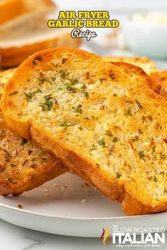 two pieces of bread on a white plate with the words air fryer garlic bread recipe