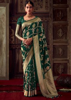 Embrace the glamor of the occasion in this sophisticated green georgette and banarasi silk designer sari. The seems stylish and ideal for any event. includes a blouse that matches. Occasion: Wedding Wear, Party Wear, Festive Wear, Engagement Wear, Mehendi Wear, Casual Wear, Diwali SAREE DETAILS :- FABRIC : Georgette Silk WORK : Banarasi LENGTH : 5.5 meter COLOR : Bottle Green  BLOUSE DETAILS :- FABRIC : Georgette Silk WORK : Banarasi SIZE : 0.80 meter (up to 44 bust size) COLOR: Bottle Green STI Bottle Green Blouse, Crepe Saree, Green Saree, Trendy Sarees, Contrast Blouse, Latest Sarees, Indian Sari, Wear Saree, Work Sarees